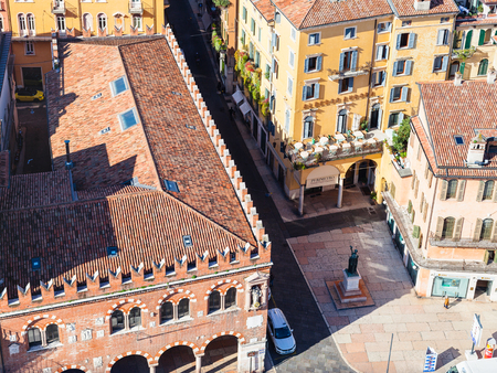 VERONA, ITALY - MARCH 29, 2017: above view of Casa dei Mercanti (House of the Merchants, Domus Mercatorum) on Piazza delle Erbe in Verona city from tower Torre dei Lamberti in springのeditorial素材