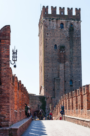 VERONA, ITALY - MARCH 27, 2017: view of Castle through Castelvecchio (Scaliger) Bridge in Verona city in spring. The fortified bridge was built in 1354 - 1356のeditorial素材