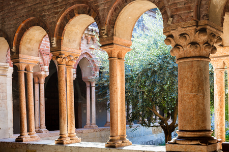 VERONA, ITALY - MARCH 27, 2017: arcade in court of Basilica di San Zeno (San Zeno Maggiore, San Zenone) in Verona city. Church was built over the burial place of Veronese bishop San Zenoのeditorial素材