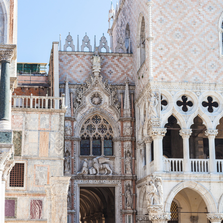 travel to Italy - decorated portal of Doge's palace on Piazza San Marco in Venice city in spring dayの写真素材
