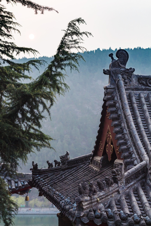LUOYANG, CHINA - MARCH 20, 2017: roof of pagoda on East Hill of Chinese Buddhist monument Longmen Grottoes in spring. The complex was inscribed upon the UNESCO World Heritage List in 2000のeditorial素材