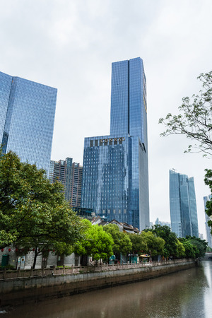 GUANGZHOU, CHINA - MARCH 31, 2017: skyscrapers on embankment in Zhujiang New Town of Guangzhou city in spring rain. Guangzhou is the third most-populous city in China with population about 13,5 mlnのeditorial素材