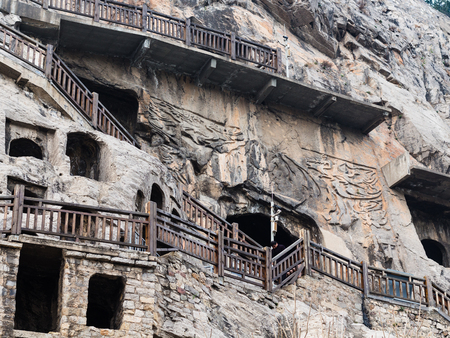 LUOYANG, CHINA - MARCH 20, 2017: caves and rooms in Chinese Buddhist monument Longmen Grottoes (Longmen Caves). The complex was inscribed upon the UNESCO World Heritage List in 2000のeditorial素材