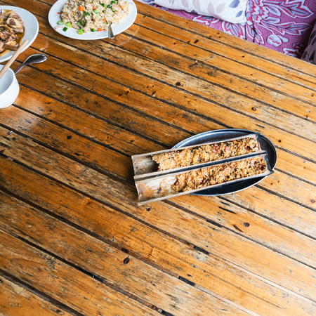 travel to China - top view of fried rice in bamboo trunk in rustic eatery in area Dazhai Longsheng Rice Terraces (Dragon's Backbone terrace, Longji Rice Terraces) country in springの写真素材