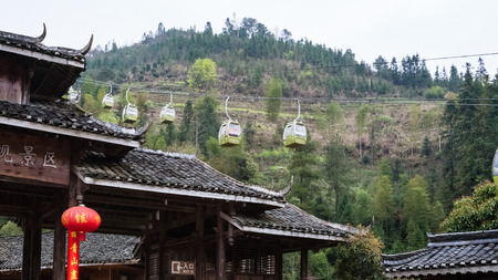 DAZHAI, CHINA - MARCH 23, 2017: cableway and gate of Dazhai Longsheng village in spring. This is central village in famous scenic area of Longji Rice Terraces in Chinaのeditorial素材