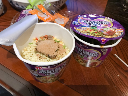 YANGSHUO, CHINA - MARCH 27, 2017: Chinese instant noodles in cups in eatery in Yangshuo. 40 billion packets of instant noodles sold annually in China , it is about half of world's consumption per yearのeditorial素材