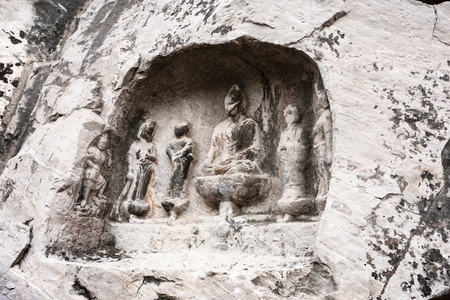 LUOYANG, CHINA - MARCH 20, 2017: relief figures in cave in West Hill of Chinese Buddhist monument Longmen Grottoes. The complex was inscribed upon the UNESCO World Heritage List in 2000のeditorial素材