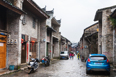 XINGPING, CHINA - MARCH 30, 2017: people on typical street in Xing Ping town in Yangshuo county in spring. The town was settled in 265 AD, Xingping is surrounded by great examples of Karst peaksのeditorial素材