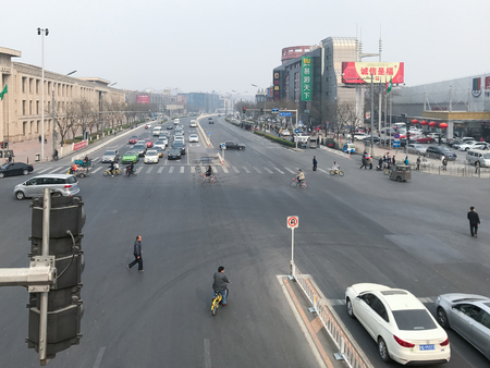 BEIJING, CHINA - MARCH 19, 2017: above view of Zhushikou road and people on pedestrian crossing in Guang'an Avenue area, on south of Tiananmen Square in spring morningのeditorial素材