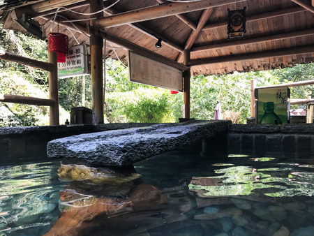 JIANGDI, CHINA - MARCH 26, 2017: stone pool with warm water from hot spring in spa hotel in Jiangdi village in resort area Longsheng Hot Springs National Forest Park of Xiangshan Districtのeditorial素材