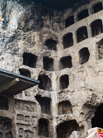 LUOYANG, CHINA - MARCH 20, 2017: caves in Chinese Buddhist monument Longmen Grottoes (Longmen Caves). The complex was inscribed upon the UNESCO World Heritage List in 2000のeditorial素材
