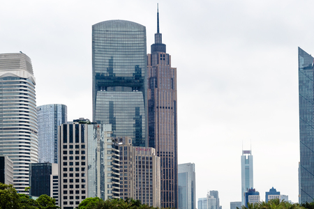 GUANGZHOU, CHINA - MARCH 31, 2017: modern skyscrapers in Zhujiang New Town of Guangzhou city in spring rainy day. Guangzhou is the third most-populous city in China with population about 13,5 mlnのeditorial素材