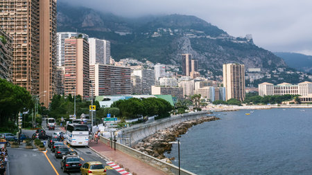 MONACO CITY, MONACO - JULY 6, 2008: tourists and cars on waterfront of Monaco city. Principality of...