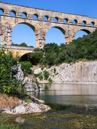 Travel to Provence, France - ancient Roman aqueduct Pont du Gard over Gardon River near Vers-Pont-du-Gard townの写真素材
