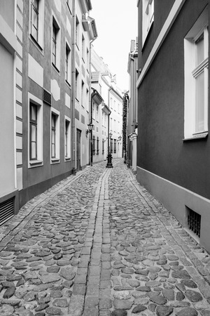 travel to Latvia - narrow street in Riga old town in autumn.の写真素材