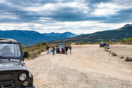 ALUSHTA, CRIMEA - SEPTEMBER 22 , 2017: tourists on jeep excursion in The Valley of Ghosts near Demerdzhi (Demirci) Mountain. The valley of Ghosts is a cluster of bizarre rocks on Demerdzhi mountのeditorial素材