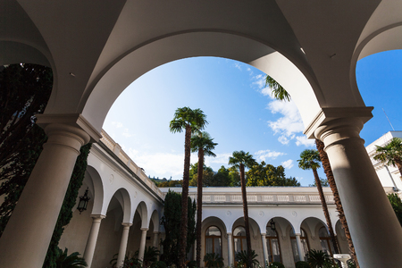 LIVADIYA, CRIMEA - SEPTEMBER 21, 2017: arcades of inner yard of Livadia Palace. The palace was the summer residence of the Russian emperor's family in Crimeaのeditorial素材