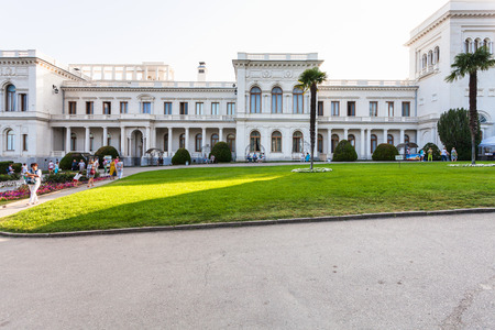 LIVADIYA, CRIMEA - SEPTEMBER 21, 2017: people and front view of Grand Livadia Palace. The palace was the summer residence of the Russian emperor's family in Crimeaのeditorial素材