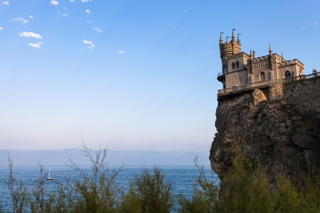 travel to Crimea - view of Swallow Nest Castle on Aurora Cliff in Gaspra District on Crimean Southern Coast of Black Sea in eveningのeditorial素材