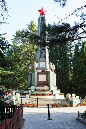 ALUSHTA, CRIMEA - SEPTEMBER 21, 2017: revolution monument in urban park on embankment in Alushta city in morning. Alushta is seaside resort town on southern coast of the Crimean peninsulaのeditorial素材