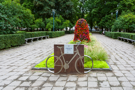 RIGA, LATVIA - SEPTEMBER 3, 2017: bicycle memorial in urban Esplanade park in center of Riga city in september.のeditorial素材
