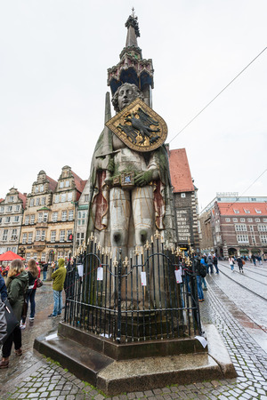 BREMEN, GERMANY - SEPTEMBER 16, 2017: people near Roland statue in Bremer Marktplatz (Bremen Market Square) in autumn rain. The square is situated in the centre of Hanseatic City of Bremenのeditorial素材