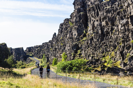 THINGVELLIR, ICELAND - SEPTEMBER 6, 2017: visitors walk to Almannagja fault in Thingvellir. Thingvellir is historical, cultural, and geological site, it is one of the most popular tourist destinationsのeditorial素材