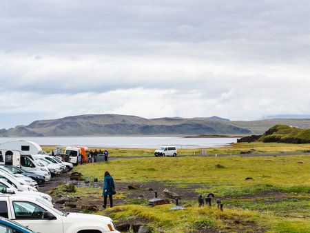 VIK I MYRDAL, ICELAND - SEPTEMBER 9, 2017: people on car parking of Reynisfjara black sand lava beach in Iceland, near Vik I Myrdal village on Atlantic South Coast in Katla Geopark in septemberのeditorial素材