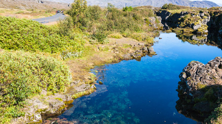 travel to Iceland - water in Silfra earth crack in rift valley of Thingvellir national park in septemberの写真素材