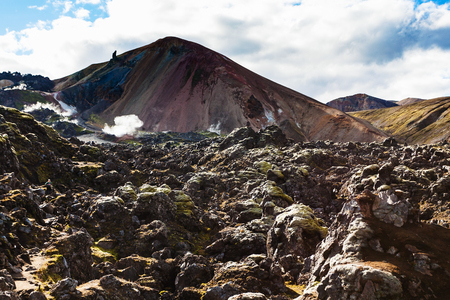 travel to Iceland - view of Mount Brennisteinsalda from Laugahraun volcanic lava field in Landmannalaugar area of Fjallabak Nature Reserve in Highlands region of Iceland in septemberの写真素材