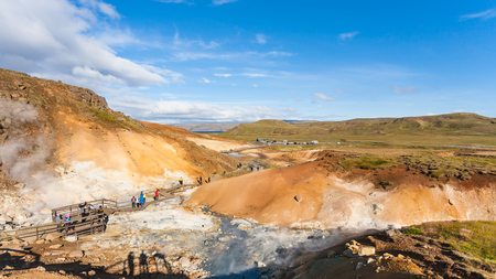 travel to Iceland - people at observation deck in geothermal Krysuvik area on Southern Peninsula (Reykjanesskagi, Reykjanes Peninsula) in septemberの写真素材