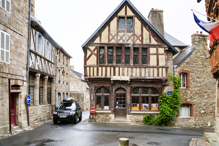 TREGUIER, FRANCE - JULY 2, 2010: big russian car with tourists on narrow street near Ernest Renan's house in Treguier town. Treguier is port town in the Cotes-d'Armor department in Brittany.のeditorial素材