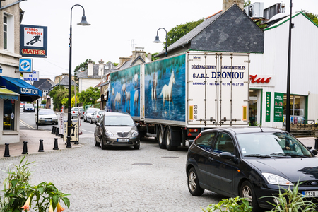 PERROS-GUIREC, FRANCE - JULY 2, 2010: car traffic on street Boulevard Aristide Briand in Perros-Guirec town in summer evening. Perros-Guirec is commune in the Cotes-d'Armor department in Brittanyのeditorial素材