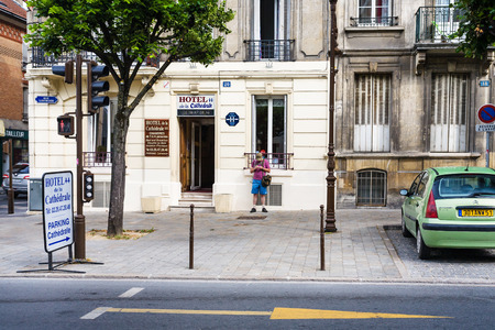 REIMS, FRANCE - JUNE 29, 2010: tourist near hotel on street rue Libergier in summer morning. Reims was founded by the Gauls, it became a major city during the period of the Roman Empireのeditorial素材
