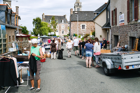 PAIMPOL, FRANCE - JULY 4, 2010: people on outdoor flea market on square Place de Kerity in Chemin de Kerguemest district of Paimpol town. Paimpol is commune in the Cotes-d'Armor department in Brittanyのeditorial素材