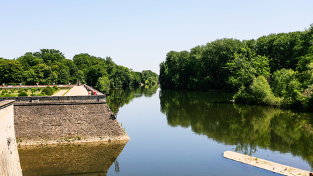 CHENONCEAUX, FRANCE - JULY 8, 2010: visitors on waterfront of Cher river in garden of castle Chateau de Chenonceau. Current palace was built in Indre-et-Loire departement of Loire Valley in 1514-1522のeditorial素材