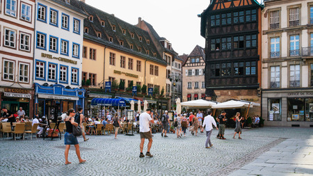 STRASBOURG, FRANCE - JULY 10, 2010: tourists on square Place de La Cathedrale near medieval houses. Roman Catholic cathedral was built in 1015-1439 years in Romanesque and Gothic stylesのeditorial素材