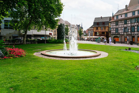 COLMAR, FRANCE - JULY 11, 2010: people near fountain on Place des Unterlinden in Colmar. Colmar is the third-largest commune of Alsace region, town is considers itself as the capital of Alsatian wineのeditorial素材