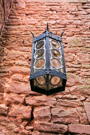 ORSCHWILLER, FRANCE - JULY 11, 2010: old lantern in castle Chateau du Haut-Koenigsbourg in Alsace. First time the castle was mentioned in 1147, the building was restored and rebuilt in 1900-1908のeditorial素材