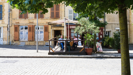 SEDAN, FRANCE - JUNE 30, 2010: people in outdoor cafe on square "Place du Chateau" near Sedan castle in summer day. Town Sedan is a commune in Ardennes department, the castle began to be built in 1424のeditorial素材