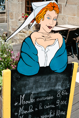 TREGUIER, FRANCE - JULY 6, 2010: typical street advertising sign of local seafood restaurant in Treguier city. Treguier is port town on English Channel in the Cotes-d'Armor department in Brittanyのeditorial素材