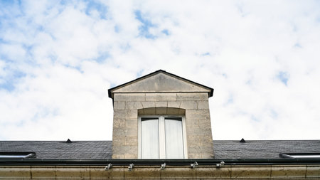 travel to France - window in attic on roof of house in Orleans city