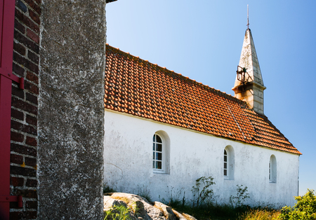 Side view of Saint-Michel chapel on Ile-de-Brehat island in Cotes-d'Armor department of Brittany in summer sunny dayのeditorial素材