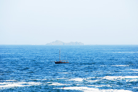 travel to France - view island in English Channel from Saint-Guirec area of Perros-Guirec commune on Pink Granite Coast of Cotes-d'Armor department in the north of Brittany in summer morningの写真素材