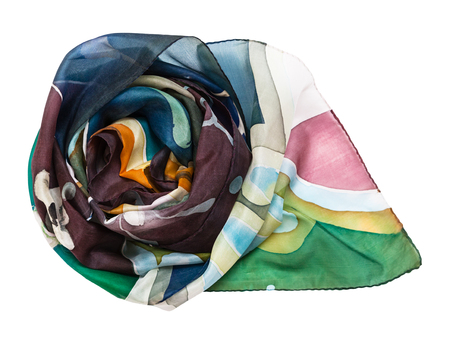 rolled hand painted batik silk scarf with abstract floral pattern isolated on white backgroundの写真素材