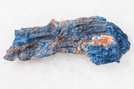 macro shooting of natural mineral rock specimen - raw Rhodusite stone on white marble background from Kazakhstanの写真素材