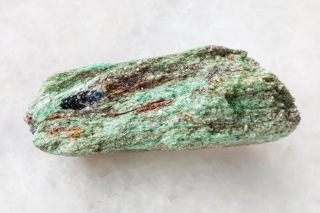 macro shooting of natural mineral rock specimen - raw Paragonite stone on white marble background from Borisovskie Hills (Sopki) mine, Ural Mountains, Russiaの写真素材