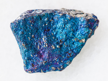 macro shooting of natural mineral rock specimen - blue Chalcopyrite stone on white marble background from Mexicoの写真素材