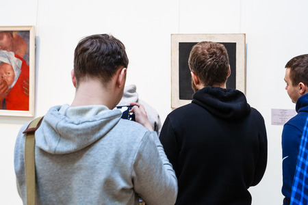 SAINT PETERSBURG, RUSSIA - MARCH 18, 2018: visitors visitors near painting in Hermitage Museum in General Staff Building. The State Hermitage is second largest museum of art and culture in the worldのeditorial素材