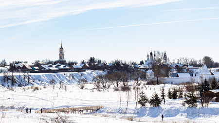 panorama of Suzdal town with Prepodobenskay bell tower in Monastery of Deposition of the Robe, Church of the Ascension in Alexandrovsky Convent and walls of Convent of the Intercession in winterの写真素材